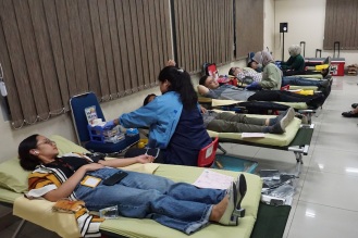 Taking part in a blood donation campaign (Indonesia)