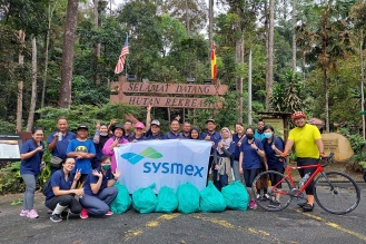Carrying out a neighborhood cleaning activity (Malaysia)
