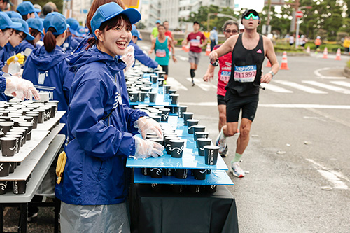 Water-supply volunteer at Kobe Marathon (Japan)