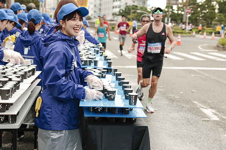Volunteering at a water station on the Kobe Marathon course (Japan)